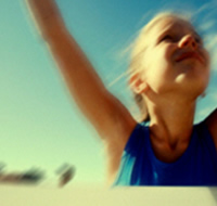 Winner - Girl Crossing Finish Line
